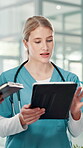 Woman, talk and doctor with tablet at hospital for planning, feedback and medical results of surgery. Surgeon, discussion and digital for staff update, healthcare report and brainstorming of solution