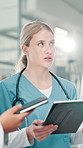 Woman, discussion and doctor on tablet at hospital for planning, feedback and medical results of surgery. Person, talking and digital for staff update, healthcare report and brainstorming of solution