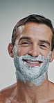 Happy man, face and beard with cream for shave, hair removal or epilation on a white studio background. Portrait, male person or model with cosmetics, foam or soap for hygiene or facial grooming