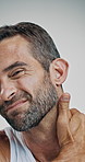 Face, man and massage for neck pain in studio with joint tension, muscle sprain and spine accident. Portrait, person and discomfort with fibromyalgia, osteoporosis risk and relief on white background
