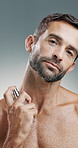 Man, face or spray with perfume in studo for aroma, smell or personal hygiene on a background. Portrait, male person or maturemodel with cologne or cosmetics for odor mask, cosmetology or scent