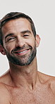 Studio, smile and skincare for man, beauty and facial treatment for grooming of skin and dermatology. White background, glow and person with routine for self care, cosmetics and smooth face in USA