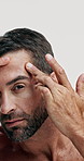 Beauty, forehead and wrinkles with face of man in studio for dermatology, anti aging and self care. Spa treatment, cosmetics and check with mature person on white background for grooming and facial