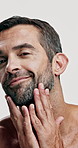 Studio, shine and skincare for man, cosmetics and facial treatment for moisture of skin, face or dermatology. White background, grooming and person with routine for self care, beauty and smile in USA