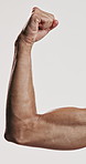 Fitness, flex and arm of man in studio for sports athlete, workout and bicep muscle progress. Body care, strong and bodybuilder with person on white background for training, exercise and wellness
