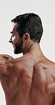 Fitness, flex and back of man in studio for sports athlete, workout and muscle progress. Body care, strong and bodybuilder with person on white background for training, exercise and wellness