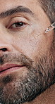 Man, serum and beauty with face closeup, skincare and moisturize with hyaluronic acid or cosmetic product. Portrait, male person with oil or liquid collagen for skin health, dermatology and self care
