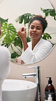Beauty, serum and mirror with woman in bathroom for self care, glow and facial treatment. Cosmetics, grooming and vitamin c dropper with person at home for dermatology, skincare and reflection