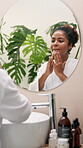 Beauty, mirror or woman with cream application for anti aging treatment, hyaluronic acid or morning routine. Reflection, african person or spf sunscreen for skin maintenance or face hydration in home