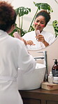 Singing, skincare and mirror with woman in bathroom for self care, music and facial treatment. Cosmetics, karaoke and eye mask with person and brush at home for dermatology, beauty and reflection