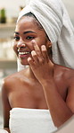 Happy, black woman and face cream with mirror for skincare, morning routine or cosmetology in bathroom. Female person, smile or creme with moisturizer or container for facial treatment at home spa