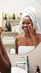 Happy, black woman and lotion with mirror for skincare, morning routine or cosmetology in bathroom. Female person, smile or face cream with moisturizer or container for facial treatment at home