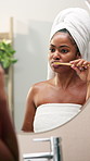 Black woman, bamboo and brushing teeth with mirror in bathroom for dental care or hygiene at home. Female person, oral clean or morning routine with reflection for gums or fresh breath at house