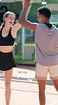 Sport, tennis and people with high five celebration on court for winning competition, match victory or game success. Doubles, athlete and excited for padel challenge, teamwork achievement or fitness