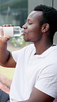 Man, break and tennis player with drink for hydration, rest or recovery together on court. Male person, athlete or friends with mineral liquid, aqua beverage or water bottle for sport match or game