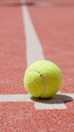 Tennis ball, sports and arena with floor of court for competition fitness, challenge match and training ground. Tournament, equipment and game with closeup in turf pitch in club for practice