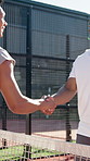 Happy men, friends and tennis player with handshake for greeting, sportsmanship or game time on court. Male people, athlete or shaking hands with smile for sport, friendly match or challenge together