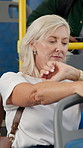 Travel, thinking and woman with watch, bus or impatient for traffic on road, commuting or delay. Checking, time and mature person in public transport, serious and late for business meeting or journey