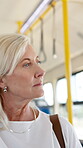 Thinking, travel and woman in bus, journey and commuting to work in morning, serious and passenger. Reflection, traveller and mature person in public transport for trip, contemplating and employee