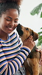 Home, dog and woman with smile, love and affection with weekend break, fun and happiness. Apartment, pet and person with animal, best friends and bonding together with trust or support in living room