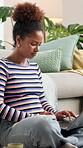 Woman, student and scroll with laptop at house for scholarship application, college essay and schedule. Female person, online and feedback for education course, university enrollment and exam results