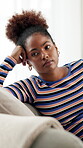 Bored, mental health and woman in lounge, home and student with  lack of motivation for education and thinking. Lonely, reflection and black person with depression, living room or thoughtful in house