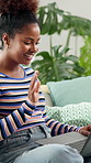 Education, laptop and video call with student woman in living room of home for distance learning. College, university or wave with happy person in apartment for remote course or virtual lesson
