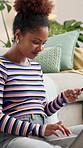 Happy, black woman and laptop with credit card on sofa for online shopping, payment or banking app at home. Female person, user or shopper with smile on computer for ecommerce or remote purchase