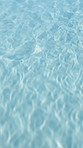 Water, ripple and pool with waves above for relaxation, holiday vacation or reflection. Top view, closeup or texture of aqua, liquid or surface of swimming tide, motion or sunlight pattern at resort