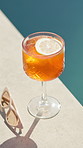 Orange, drink and pool with sunglasses for vacation, hospitality or accomodation at luxury resort. Empty, closeup or fresh beverage with lemon slice in glass for weekend getaway or summer holiday