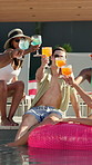 Toast, party and friends with holiday in swimming pool for weekend, break or vacation. Relax, sunglasses or group in water with smile, alcohol and people at hotel or lodge resort for summer getaway