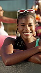 Face, smile and woman with holiday in pool party for weekend, break or vacation. Relax, sunglasses or girl in water with celebration, friends and people at hotel or lodge resort for summer getaway