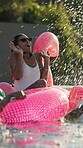 Pool party, splash and friends on holiday for fun, playful and bonding at resort. Woman, student group and water on vacation for reunion, spring break and float at luxury accommodation for relax