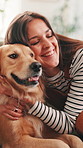 Golden retriever, woman and hug on sofa in home, smile or bonding in morning for love in living room. Girl, dog and pet animal on couch with embrace, touch or loyalty with care in lounge at apartment