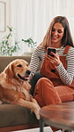 Sofa, woman and dog with smile for mobile, online research and application for pet insurance. Home, animal and golden retriever with female person for smartphone, social media and relax in lounge