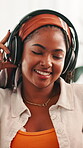 Home, listening and woman with headphones, music and streaming of playlist in living room, smile or break. Relax, song and black person with tech for audio, resting or entertainment for girl in house