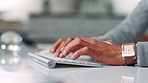 Keyboard, hands and man in office typing for finance proposal with online business client. Technology, communication and closeup of male financial advisor with investment report in workplace.