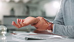 Business, hands and man in office, wrist pain and carpal tunnel syndrome with muscle tension. Closeup, person or employee in workplace, inflammation or massage with ache, osteoporosis or joint injury