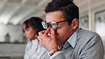 Frustrated, businessman and headache with stress or eye strain for pressure, burnout or overworked at office. Tired, man or employee with migraine, anxiety or vertigo for deadline tasks at workplace