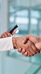 People, closeup or investor shaking hands for business funding agreement or b2b deal. Partnership, executive director or financial advisor in office for collaboration, handshake or merger meeting 