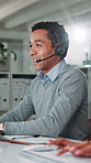 Call center, man and customer service in office with help desk, communication and online consultant. Contact us, headset and technical support crm, discussion or sales agent coworking for hotline