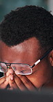 Black man, headache and stress with glasses at office, night and eye strain with burnout by computer. Person, migraine and pain with fatigue, tired or exhausted by pc with brain fog at finance agency