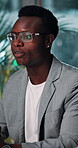 Business, black man and talk in meeting at night in office for proposal pitch, share ideas and information. Person, speaking and explanation for planning, project management and schedule of deadline 