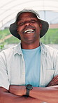 Greenhouse, black man and face with confidence for farming, agriculture and sustainable environment. Laughing, male person and farmer in portrait for eco friendly, arms crossed and produce production