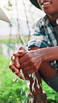 Farming, washing hands and boy with agriculture, cleaning and sustainability with countryside. Black kid, greenhouse and child with hygiene, ecology and growth with liquid to remove bacteria or dirt
