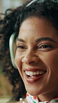 Woman, laughing and dancing with headphones in home for streaming radio, funny podcast or album track. African person, face and audio technology for groovy playlist, feel good sound and enjoying song