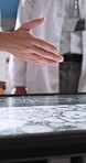 Hands, scientist and team with screen for research, microbiology test and experiment with virus analysis. Medical science, people and interactive display for innovation, discussion and study in lab