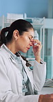 Scientist, woman and headache with stress at lab with burnout, fatigue and frustrated with medical research. Person, pain and exhausted with migraine, tired and overworked with pharmaceutical study