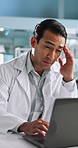 Scientist, man and headache by laptop with pain in lab, overworked and overwhelmed at night. Migraine, vertigo and burnout with deadline pressure, negative research results and medical problem