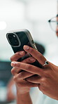 Businesswoman, hands and chat with smartphone in office, workplace and online for communication. Closeup, female person and consultant with mobile for application, social media and break for text
